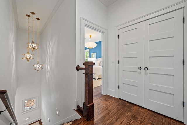 1081 Terrell Cir, Greensboro, GA 30642 - entrance foyer with ornamental molding and dark wood-style flooring