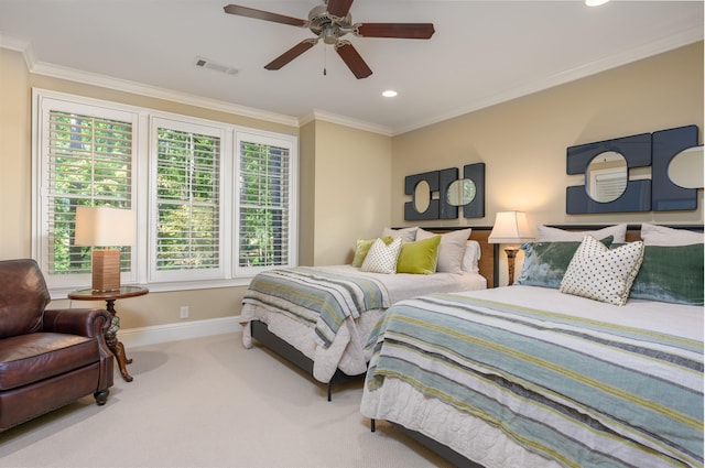 carpeted bedroom with crown molding and ceiling fan