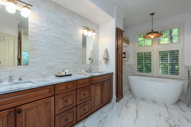 bathroom with crown molding, tasteful backsplash, tile walls, vanity, and a washtub