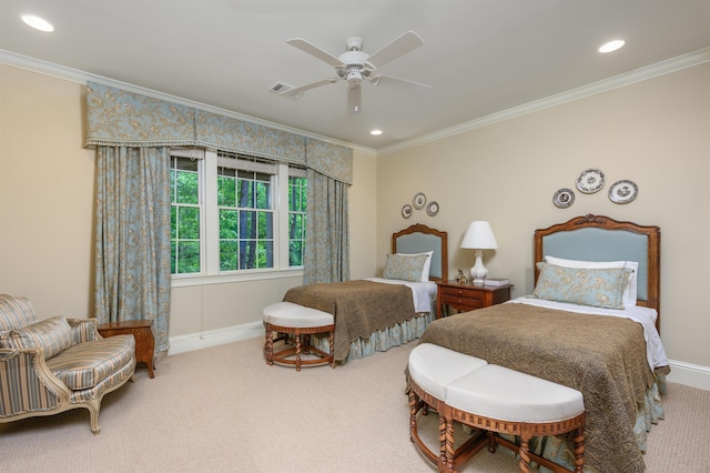 carpeted bedroom with ceiling fan and ornamental molding
