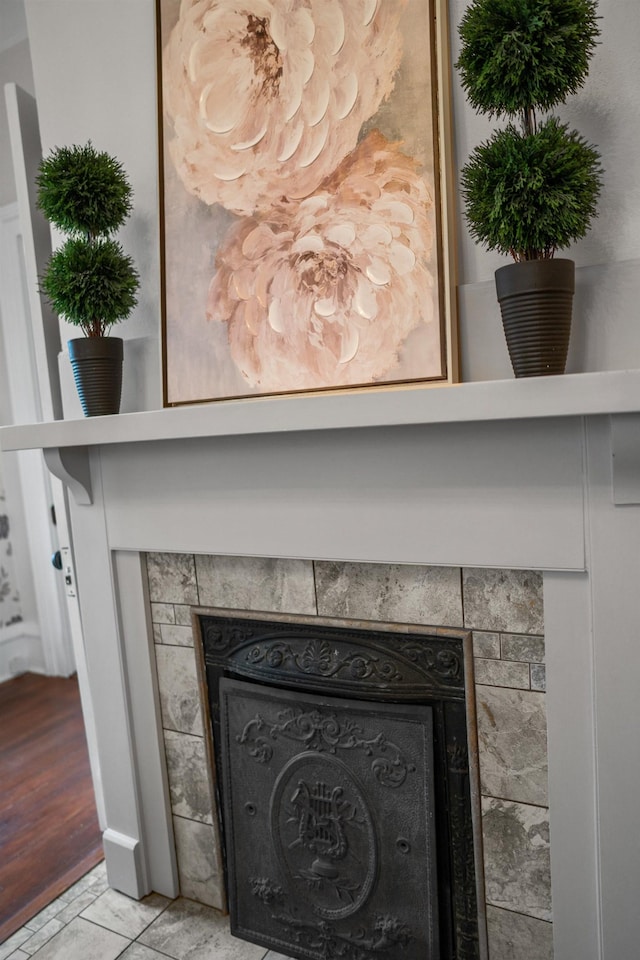 room details featuring a tile fireplace