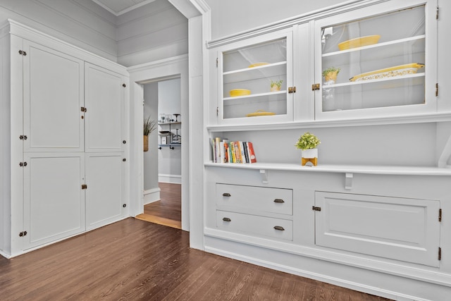 corridor featuring dark hardwood / wood-style flooring