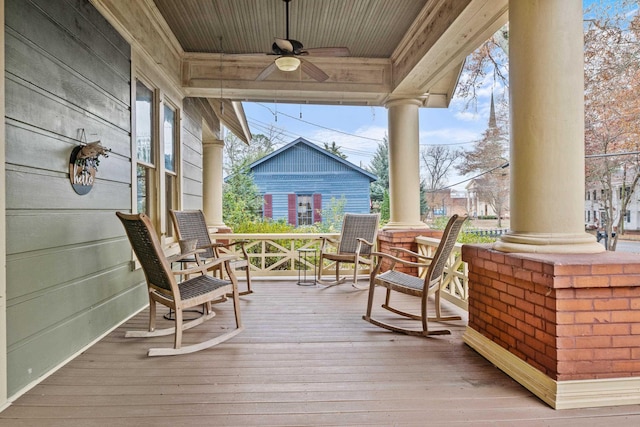 deck featuring a porch and ceiling fan