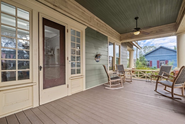 deck with covered porch and ceiling fan