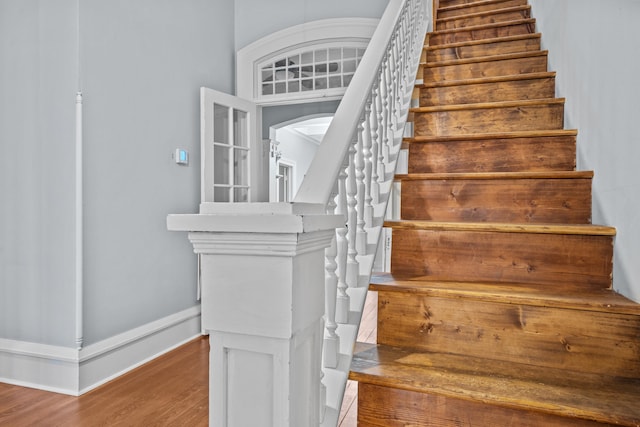 stairway featuring hardwood / wood-style floors