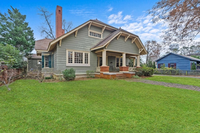 craftsman inspired home with covered porch and a front yard