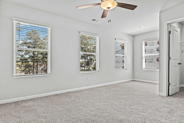 unfurnished bedroom with light colored carpet and ceiling fan