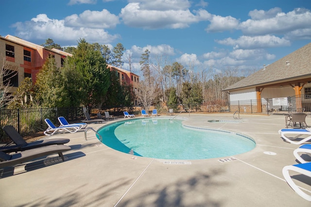 view of swimming pool with a patio