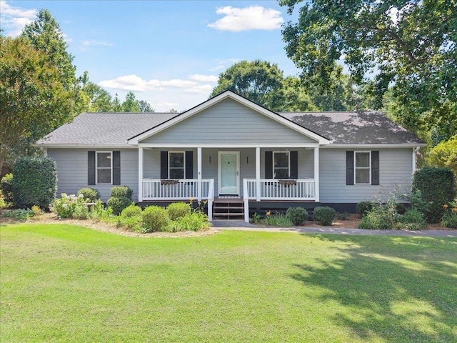 1120 Rawlings Dr, Rutledge, GA 30663 - ranch-style house featuring a porch, a front lawn, and roof with shingles