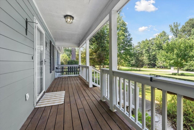 1120 Rawlings Dr, Rutledge, GA 30663 - wooden porch with view of wooded area