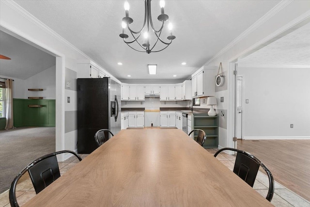 1120 Rawlings Dr, Rutledge, GA 30663 - dining area with a chandelier, crown molding, and recessed lighting