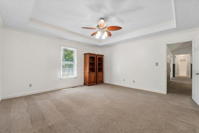 1120 Rawlings Dr, Rutledge, GA 30663 - carpeted spare room with a tray ceiling, crown molding, and a ceiling fan