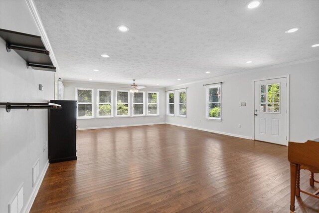 1120 Rawlings Dr, Rutledge, GA 30663 - unfurnished living room with recessed lighting, crown molding, wood finished floors, and a textured ceiling