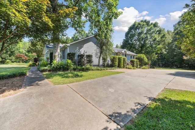 1120 Rawlings Dr, Rutledge, GA 30663 - view of home's exterior with a lawn