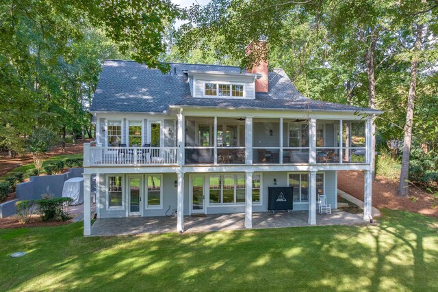 back of house with a lawn, a patio, and ceiling fan