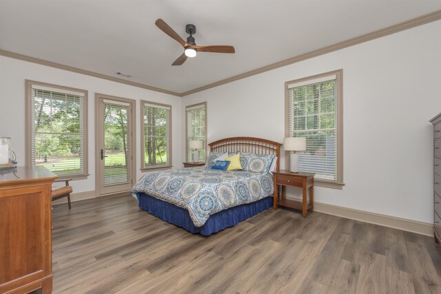 bedroom with dark hardwood / wood-style flooring, crown molding, access to outside, and ceiling fan