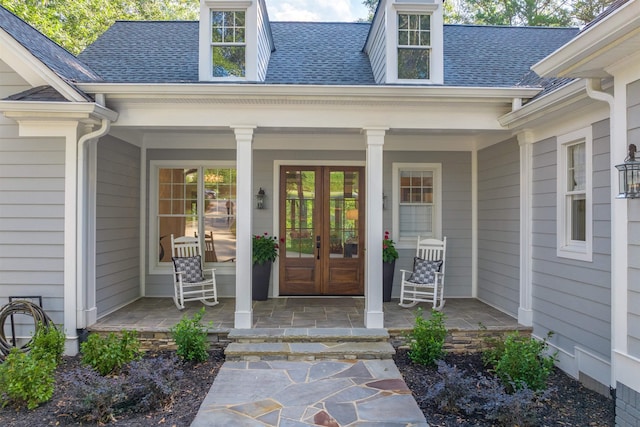 doorway to property featuring french doors and covered porch