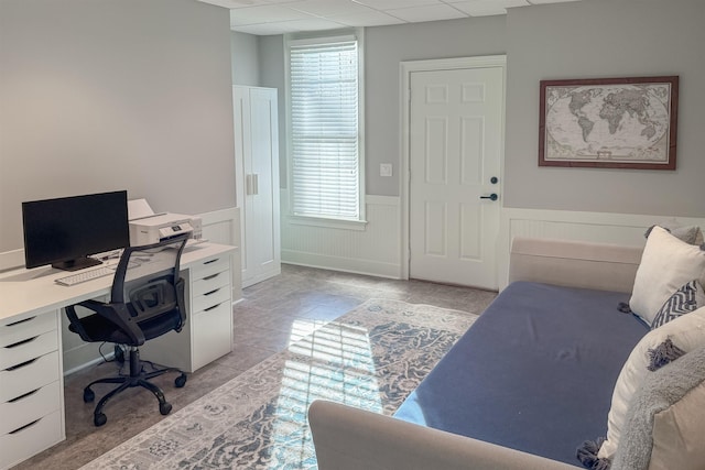 home office featuring a healthy amount of sunlight and a drop ceiling