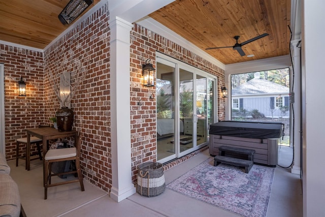 sunroom / solarium with ceiling fan and wood ceiling