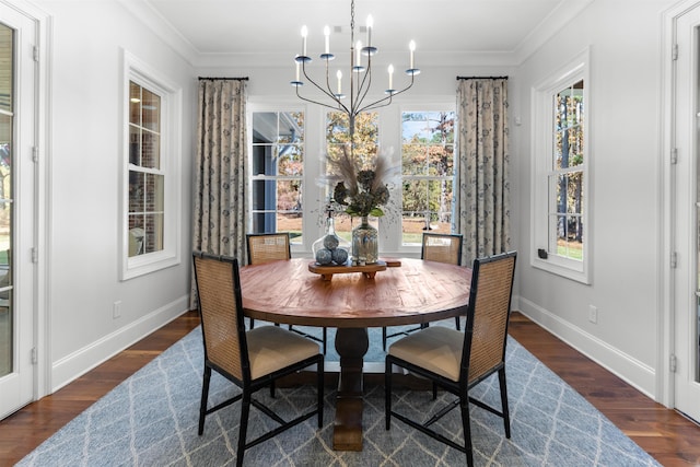 dining room with crown molding, an inviting chandelier, and dark hardwood / wood-style flooring