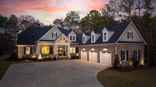 view of front of home featuring a garage and covered porch