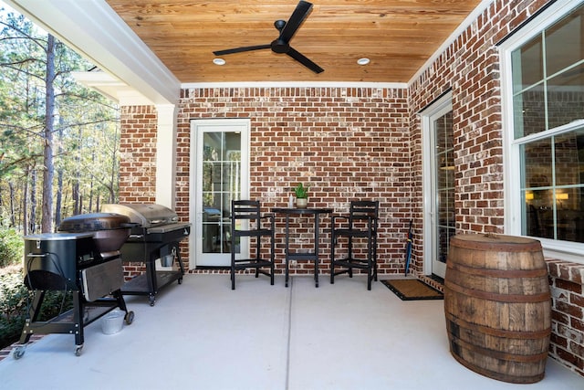 view of patio featuring area for grilling and ceiling fan