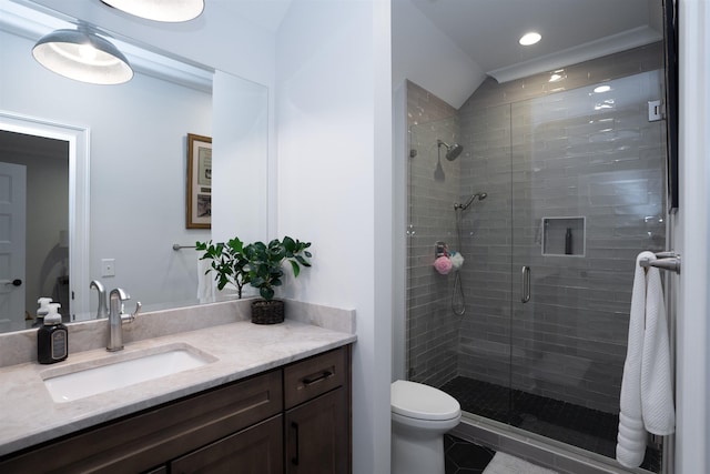 bathroom featuring walk in shower, tile patterned floors, vanity, and toilet