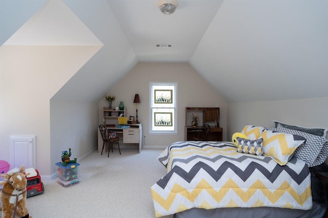 bedroom with lofted ceiling and carpet floors