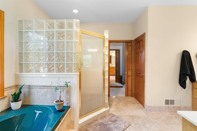 bathroom with tile patterned flooring and plus walk in shower