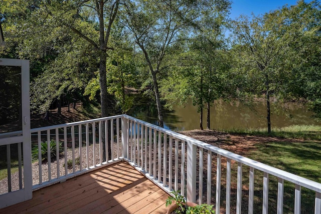 wooden terrace featuring a water view