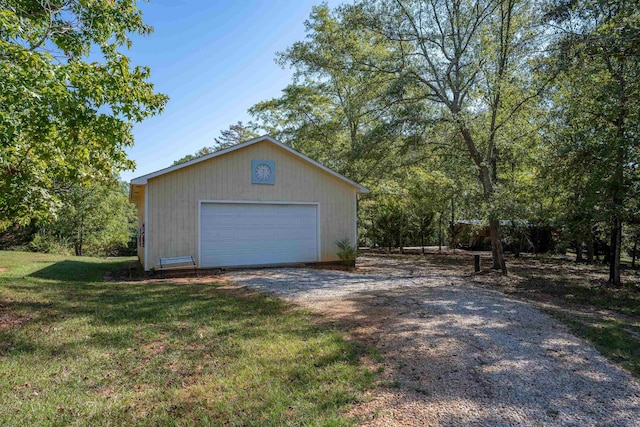 garage featuring a yard