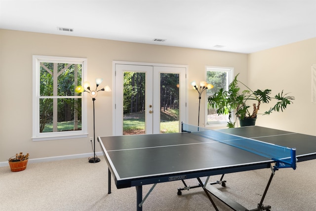 rec room featuring french doors and carpet flooring