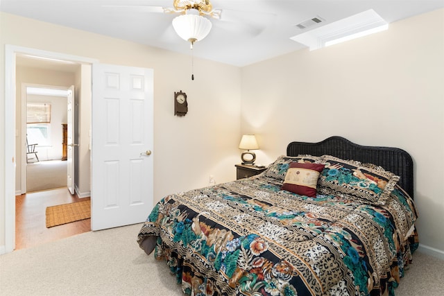 bedroom with ceiling fan and carpet flooring