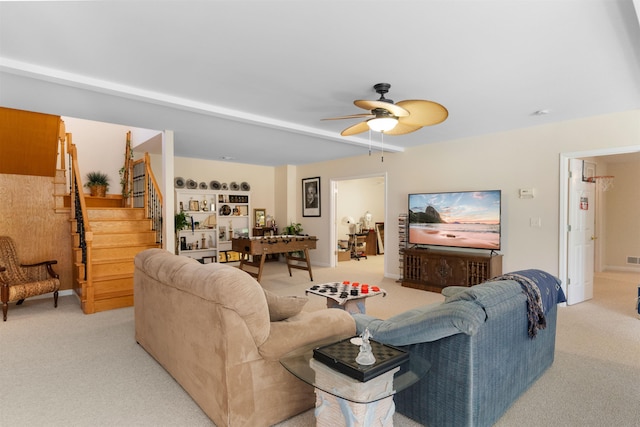 living room with light carpet and ceiling fan