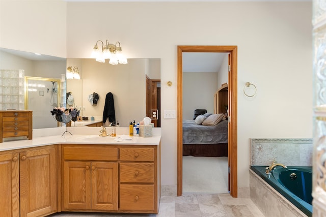 bathroom featuring vanity and independent shower and bath