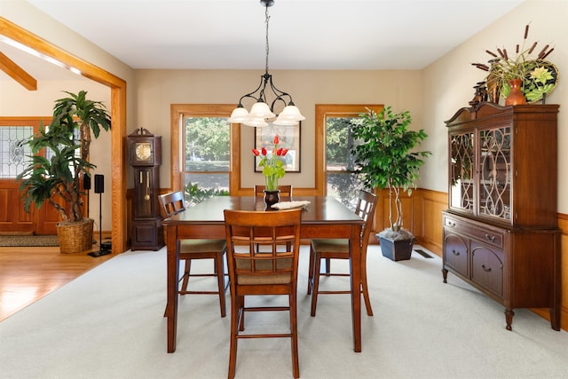 dining room with light carpet