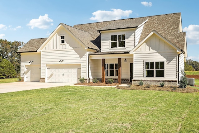 view of front facade featuring a garage, central AC, and a front lawn