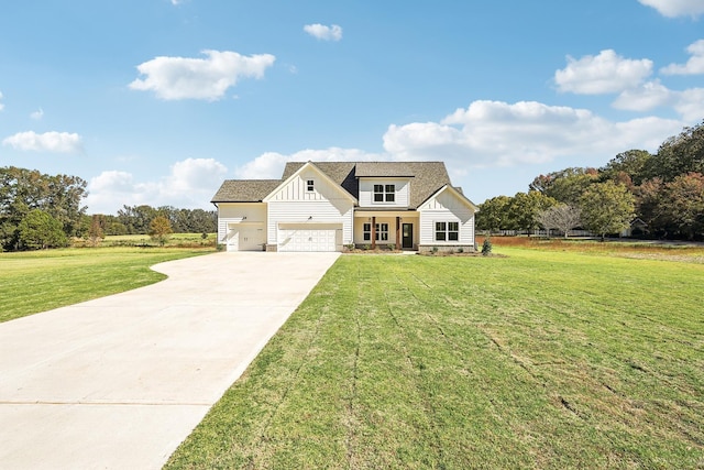 view of front of property featuring a garage and a front yard