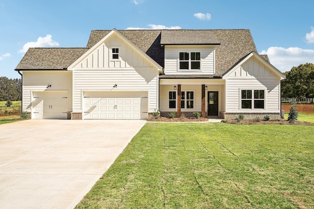 modern farmhouse style home featuring a front yard and covered porch