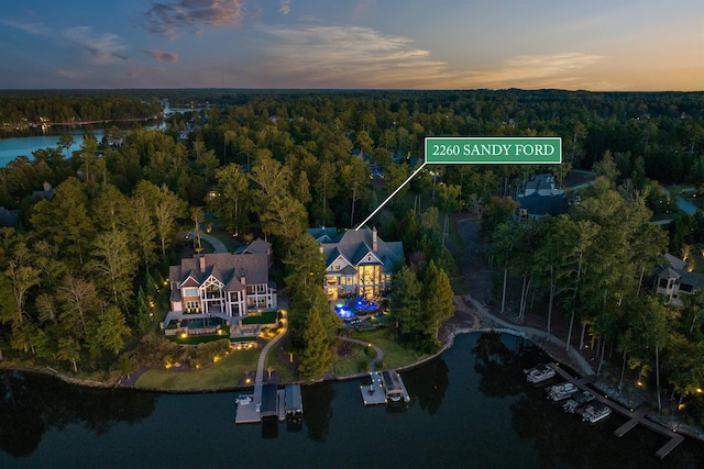 aerial view at dusk with a water view