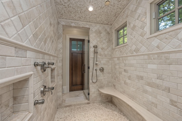 bathroom with tiled shower