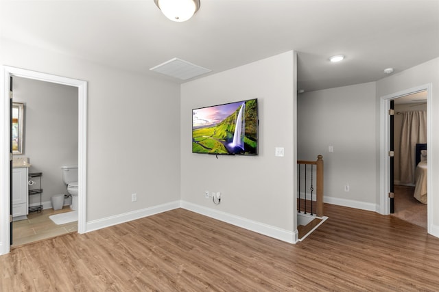 unfurnished living room featuring light wood-type flooring