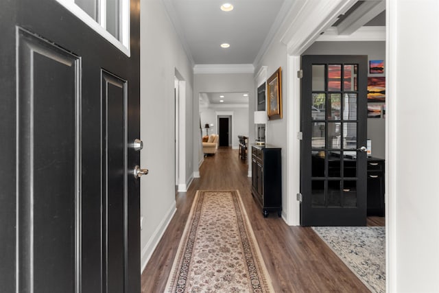 corridor with crown molding and hardwood / wood-style flooring