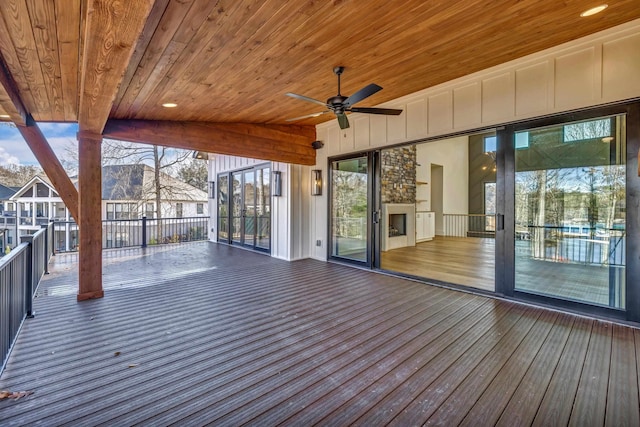 wooden terrace featuring ceiling fan