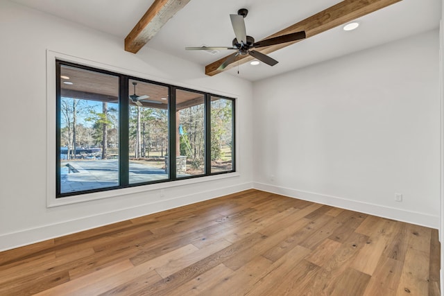 spare room with light wood-type flooring, beamed ceiling, recessed lighting, baseboards, and a ceiling fan