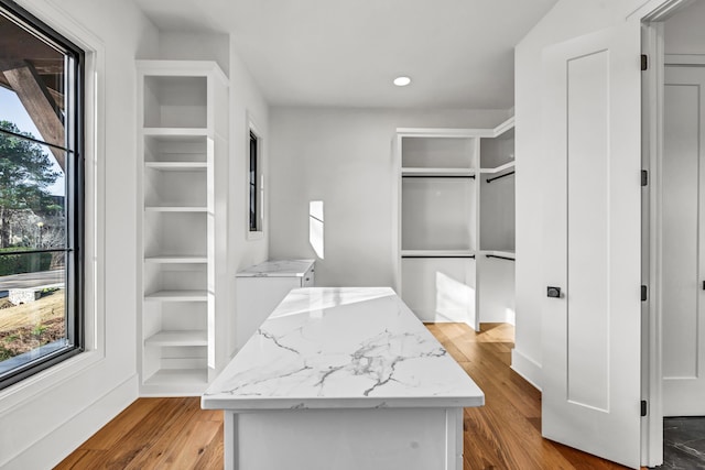 walk in closet featuring light wood-style flooring