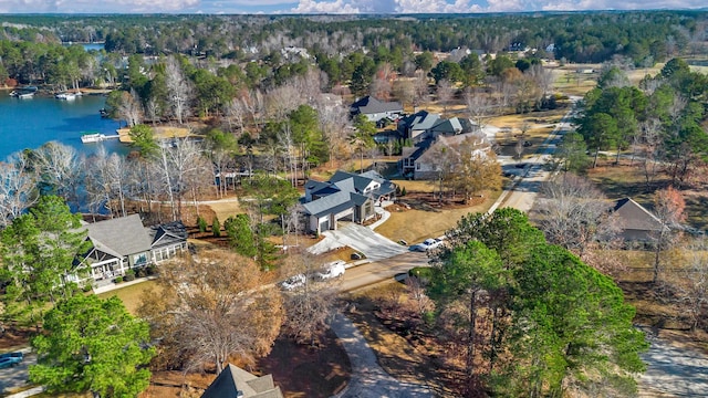 bird's eye view with a water view and a residential view