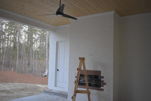 exterior space featuring ceiling fan