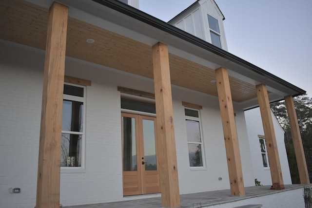 view of property exterior featuring french doors