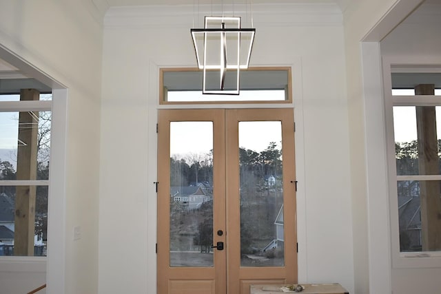 interior space featuring french doors and ornamental molding